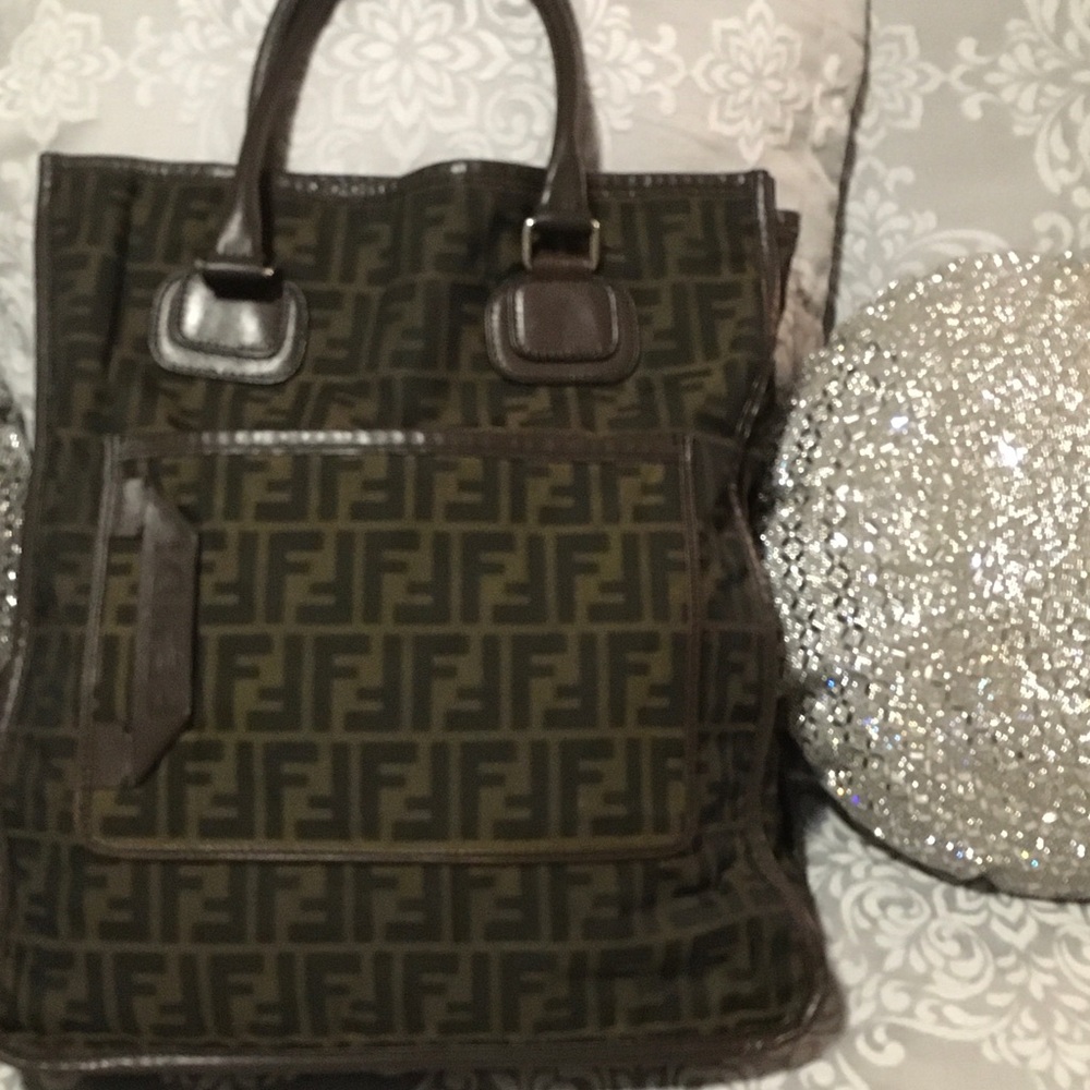 Ladies Fendi Hand Bag. The bag is 39 inches in length and 36 inches in width.